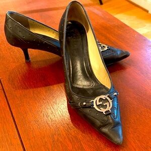 Well-loved black GUCCI heels…priced accordingly.